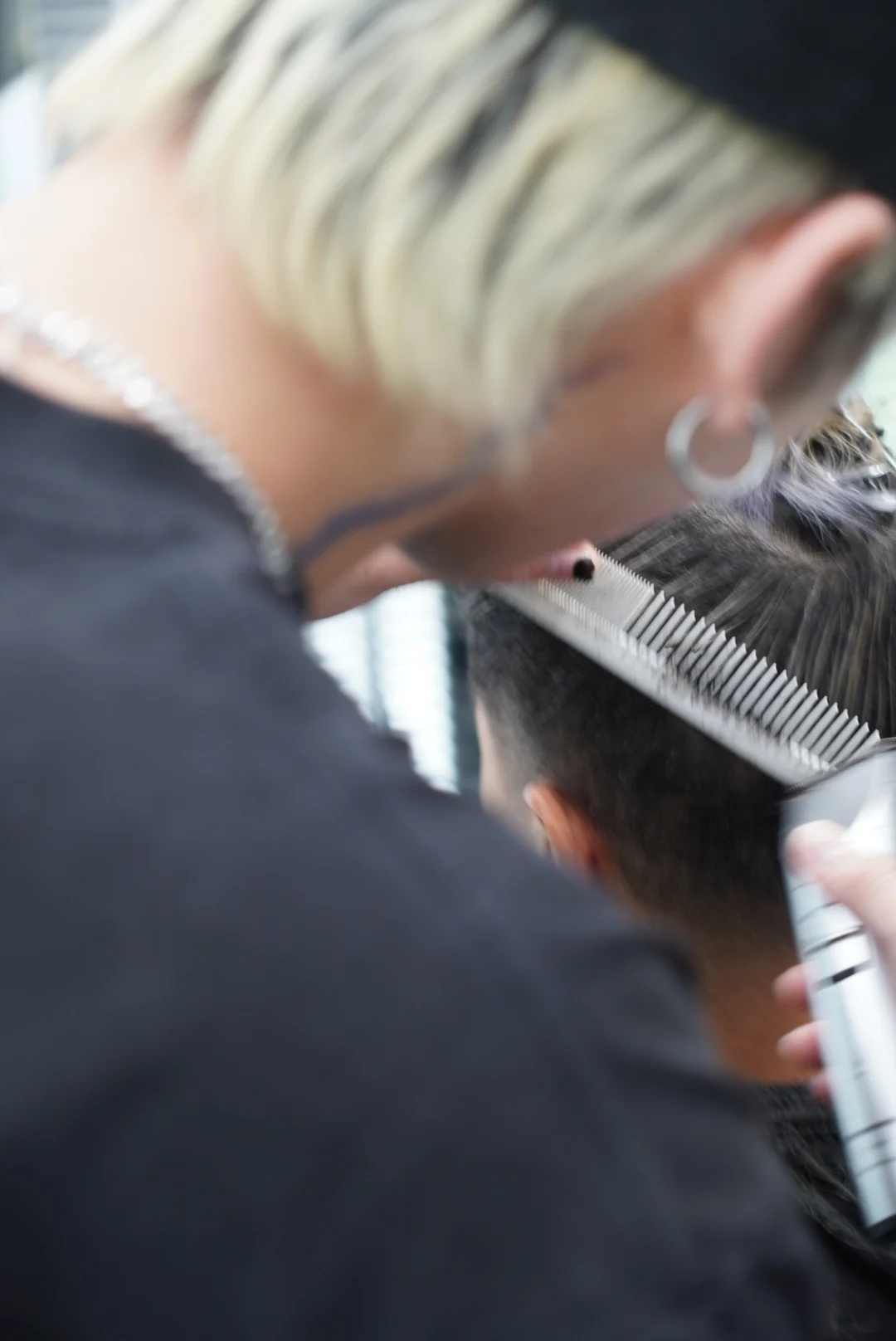 A comb and clippers at work